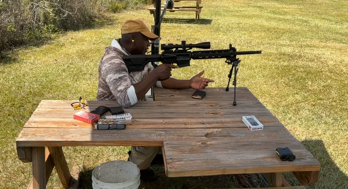 Sarg shooting from a range bench